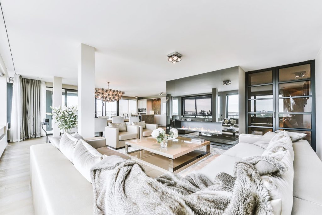 White Living Room with Mirror Fireplace